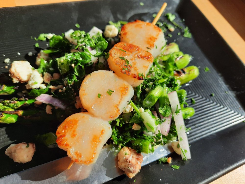 Scallops over greens. It looks tasty!