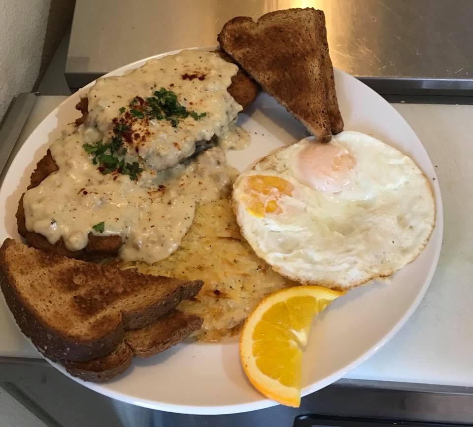 Chicken fried steak, eggs, toast and hash browns.