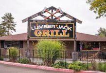 The large Lumber Jack Grill sign in front of the restaurant.