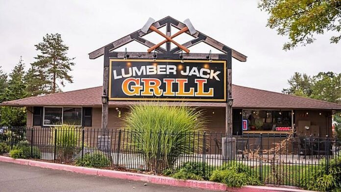 The large Lumber Jack Grill sign in front of the restaurant.