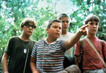 A photo of the four childhood actors in the movie Stand By Me. One is pointing at something.