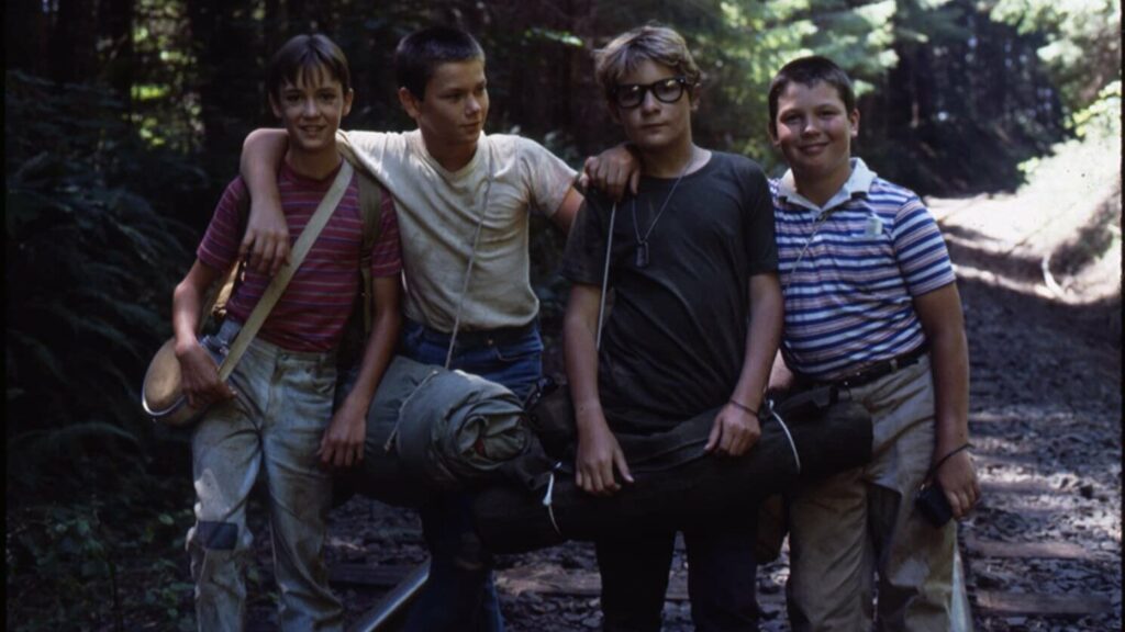 A photo of the four childhood actors in the movie Stand By Me standing side by side.