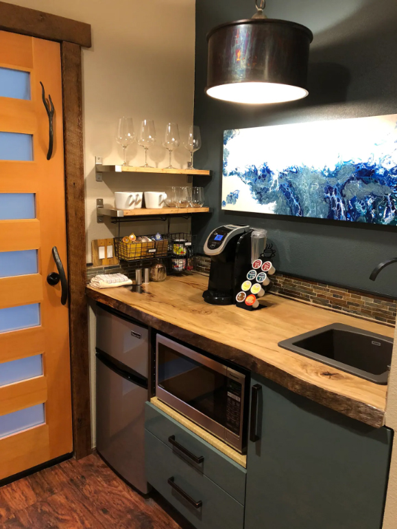 The kitchen has beautiful countertops and a Keurig waiting for guests to make coffee in the morning.