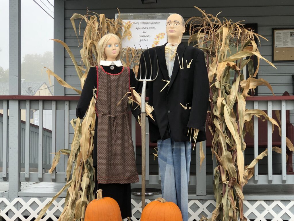 Ma and Pa scarecrow with two pumpkins.