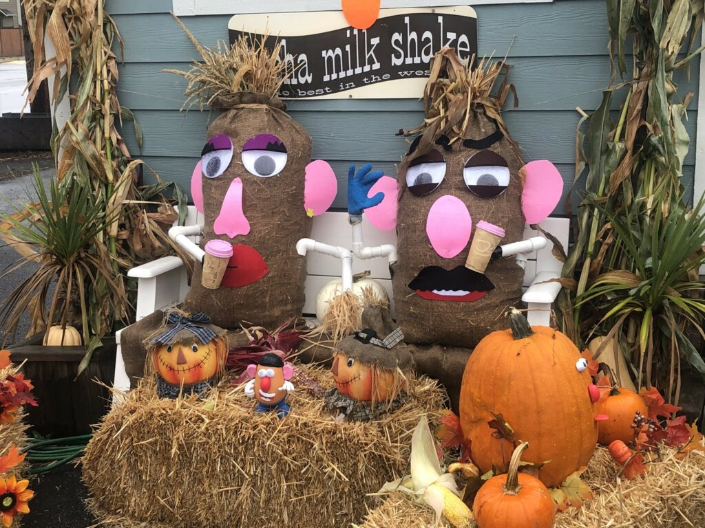 Mr. and Mrs. Potato Head scarecrows.