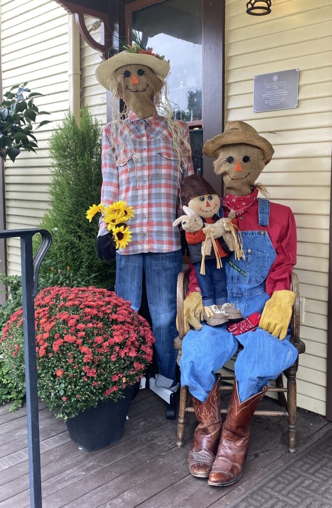 A family of brightly dressed scarecrows.