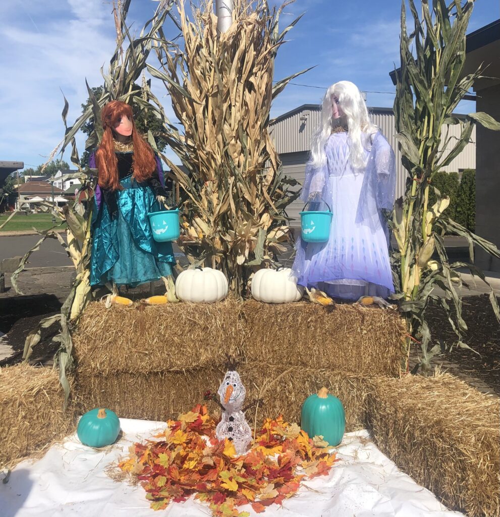 Disney's Frozen, themed scarecrows including Elsa and her sister.