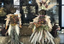 Two unique looking scarecrows.