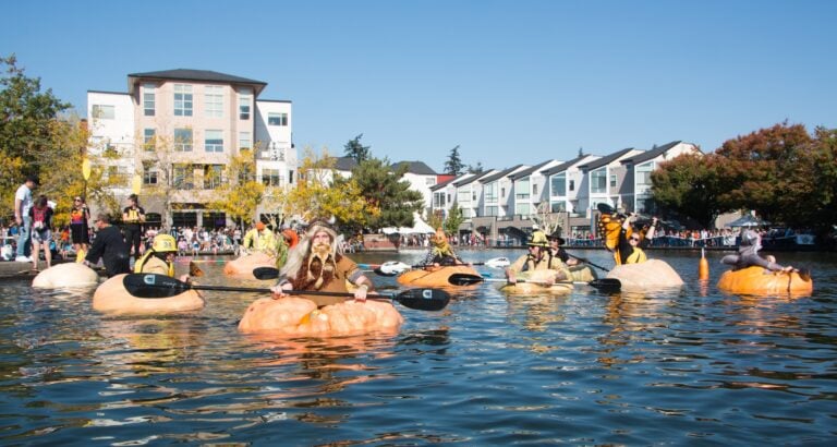 This Wildly Fun Oregon Fall Tradition Sends Costumed Racers Across a Lake Inside Giant Pumpkins