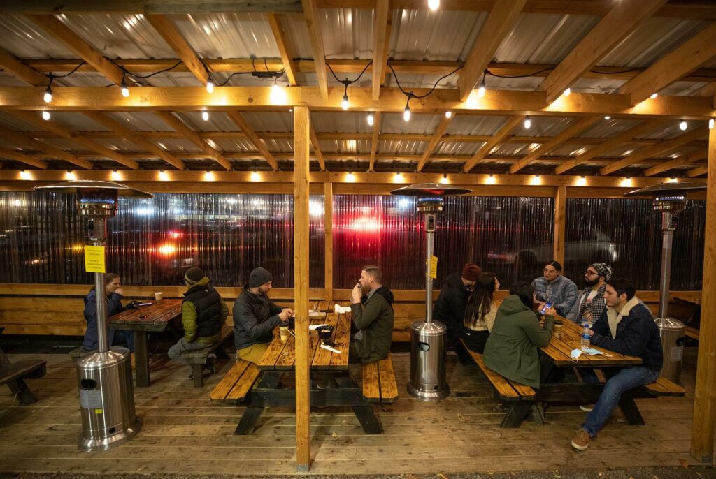 An outdoor covered seating area at Kinboshi Ramen.