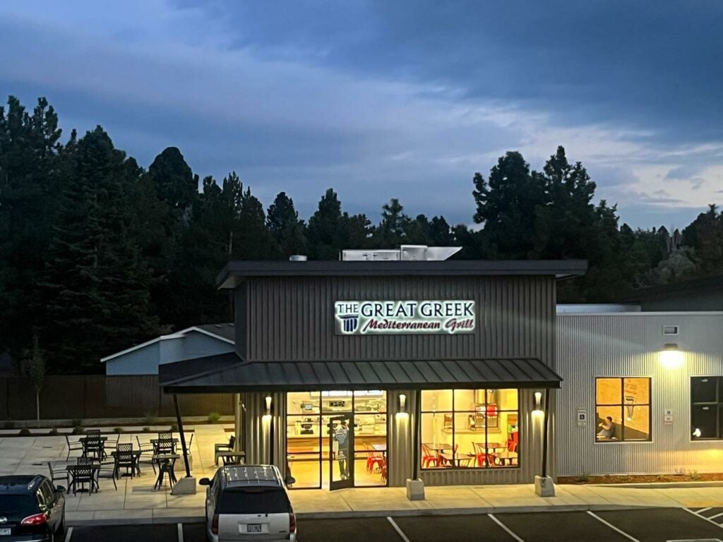The exterior of The Great Greek Grill in Bend, Oregon at night time.