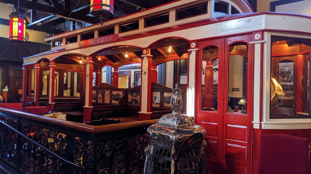 A closeup shot of the outside of the red and white trolley inside The Old Spaghetti Factory.