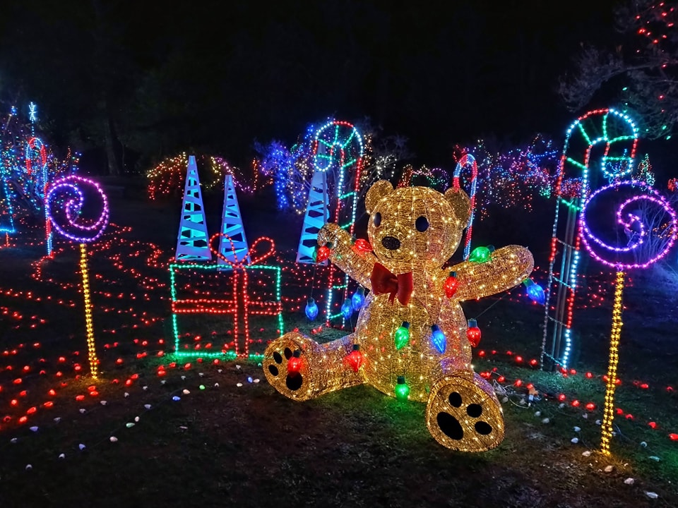 Colorful Christmas lights in the shape of a teddy bear, candy, candy canes and presents.