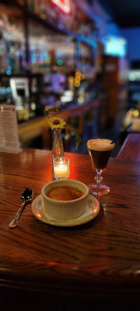 A cup of soup, a cocktail and a candle at Cassidy's Restaurant And Bar in Portland, Oregon.