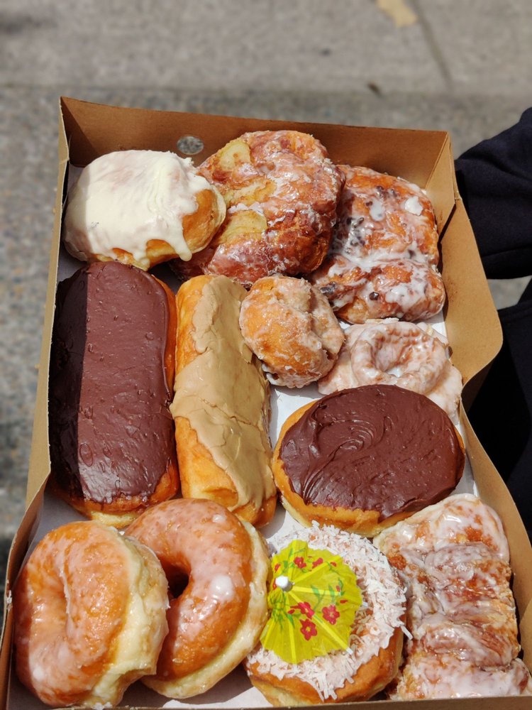 A box with a wide variety of donuts.