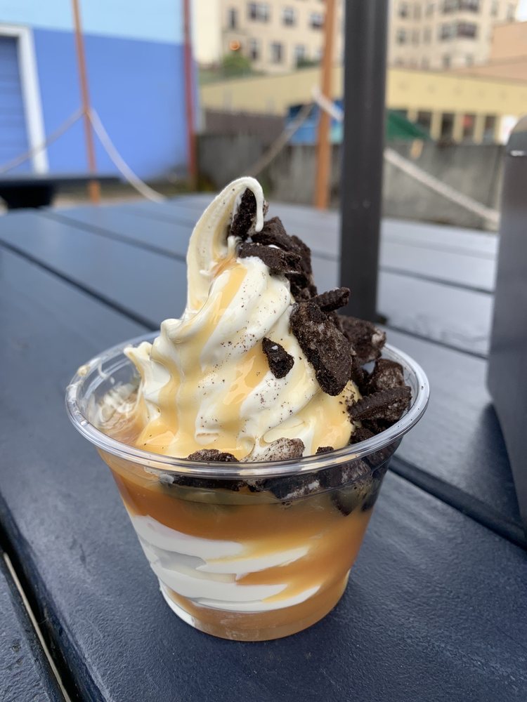 A delicious frozen custard with cookies crumbled on top.