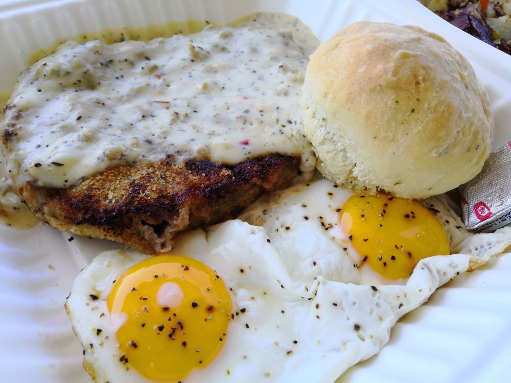 Country fried steak and eggs with a herb biscuit.
