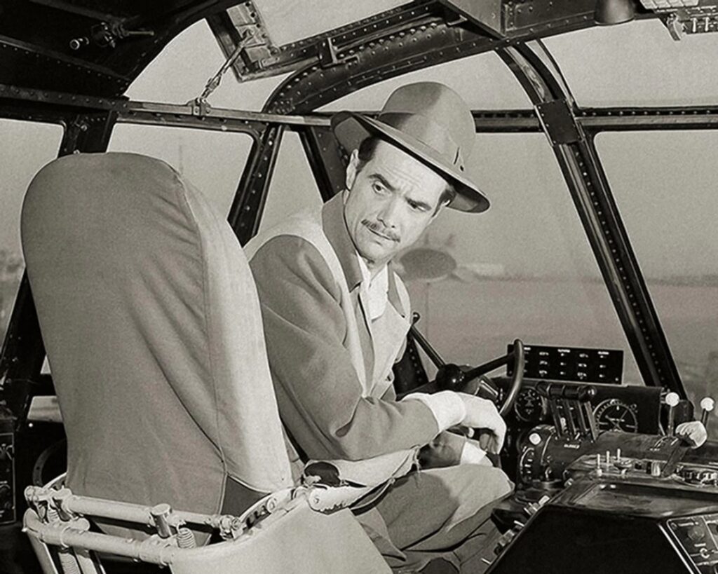 A black and white photo of Howard Hughes.