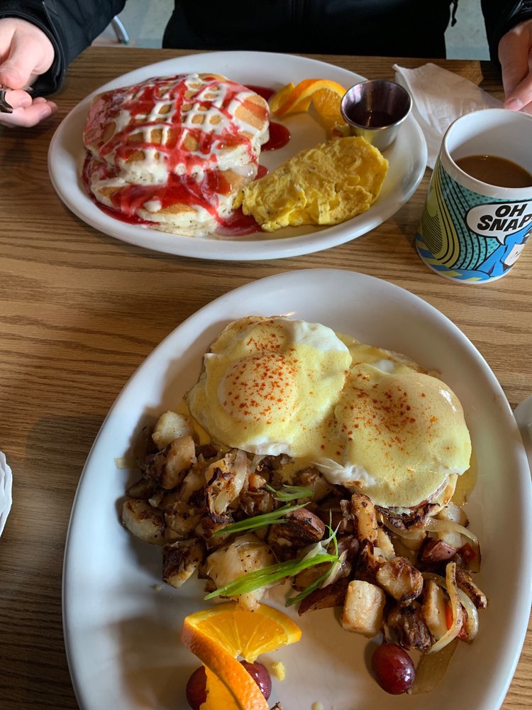 Lemon poppyseed pancake special and eggs benedict. The pancakes are drizzled in red and white syrup and sauce in an aesthetically pleasing way. Looks delicious!