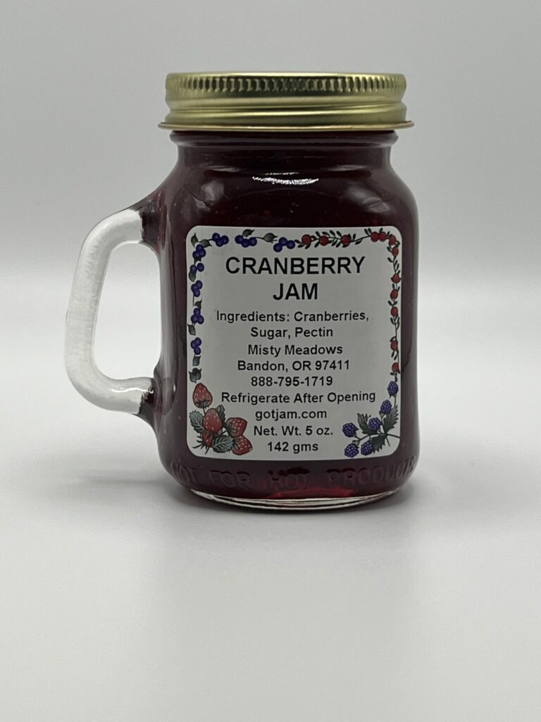 A super cute little mason jar with a handle full of Cranberry Jam.