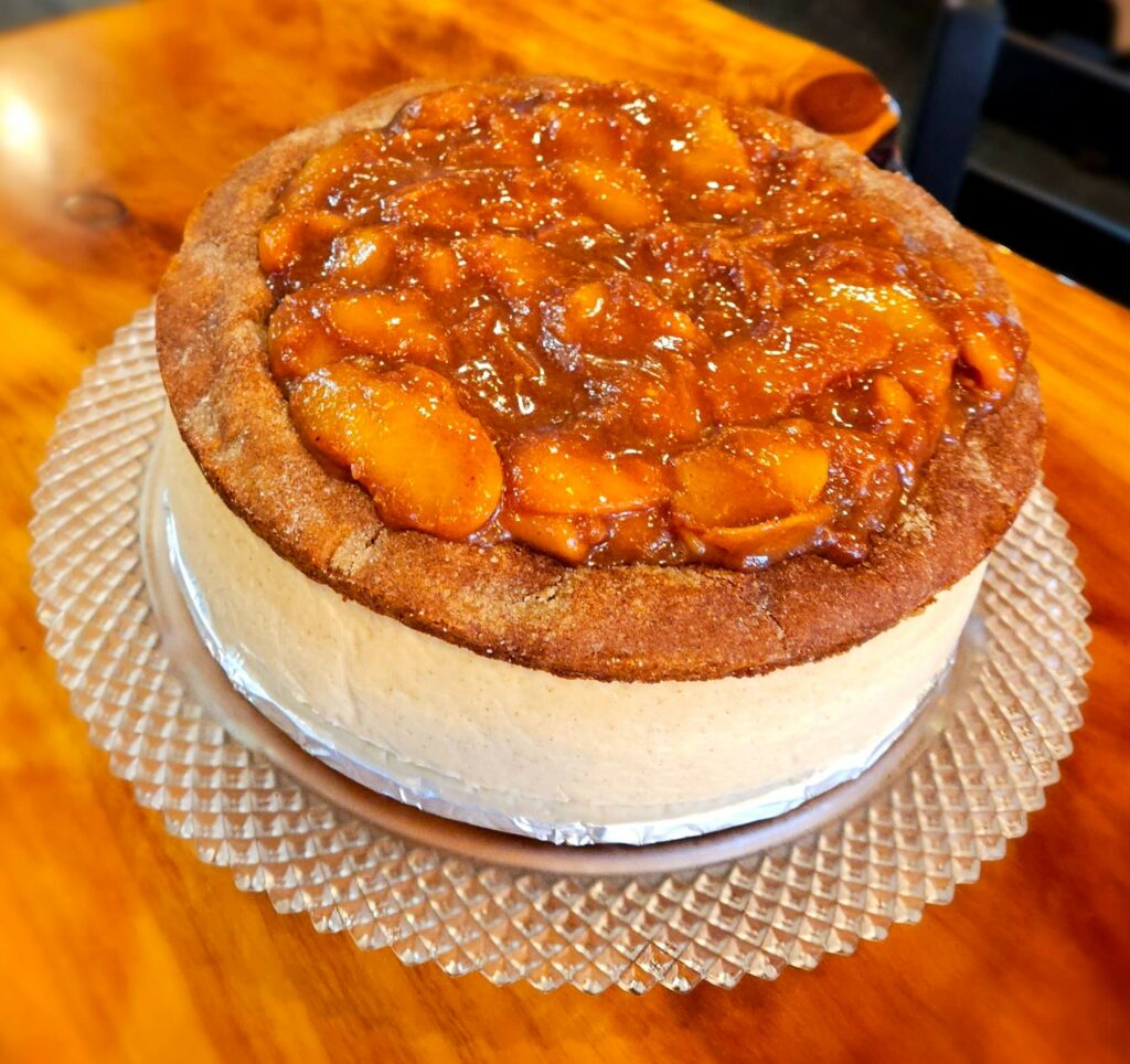 Peach blondie brown sugar cheesecake. It has peaches and sauce all over the top. It looks so good!