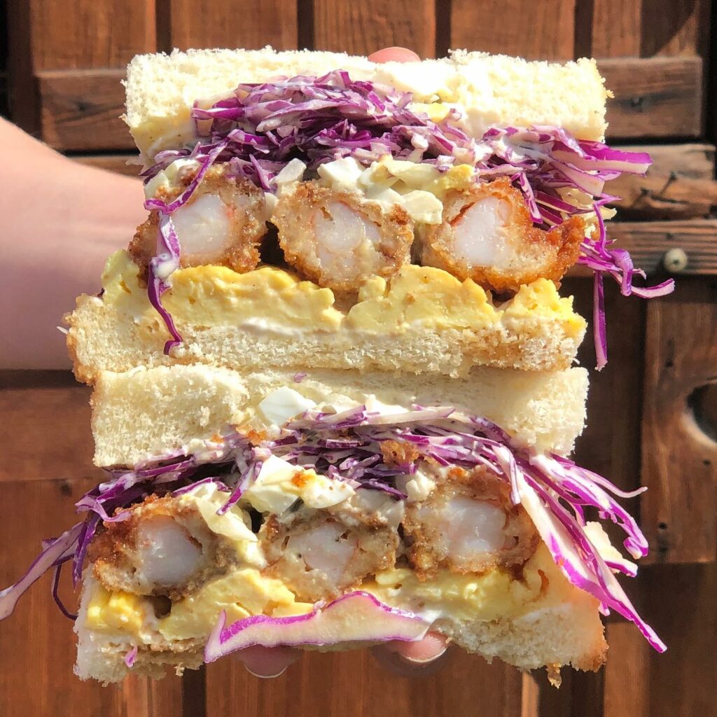 A colorful sandwich from Tokyo Sando. It's got chicken and purple cabbage. It looks so good and it's huge!
portland oregon, best restaurants, 2024, where to eat, best brunch, food and drink, bars, pizza, sushi, thai food, PDX, foodie heaven