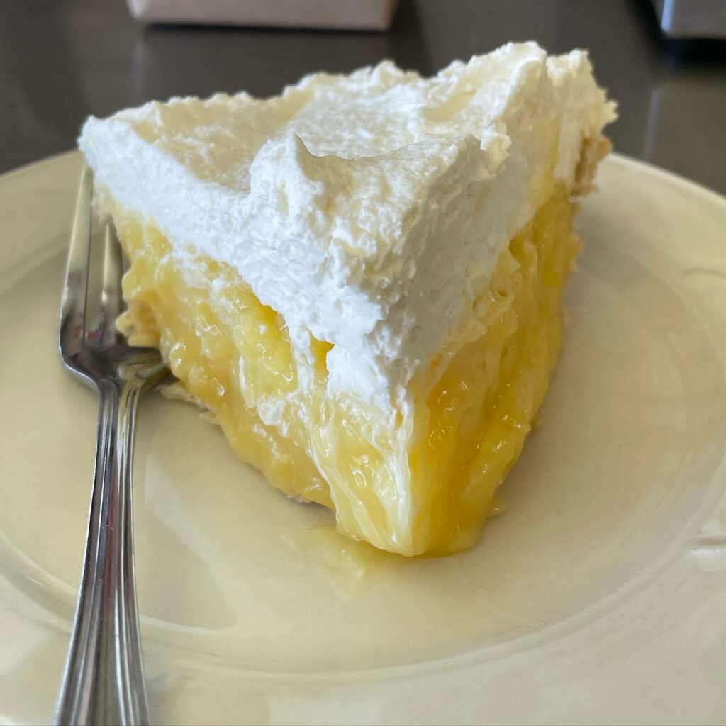 Lemon pie with whipped cream.