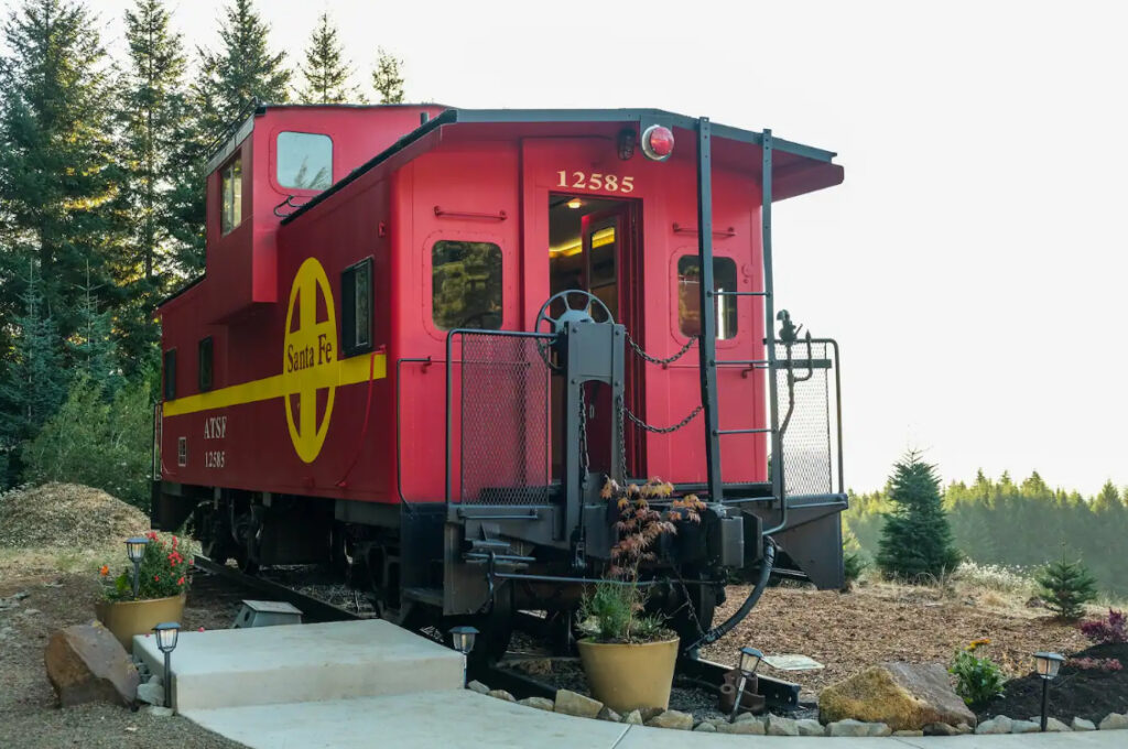 The outside of the bright red train car.