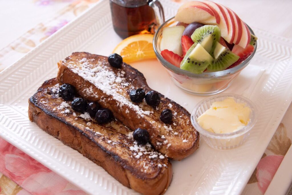 French toast made with fresh baked bread and served with fresh fruit.