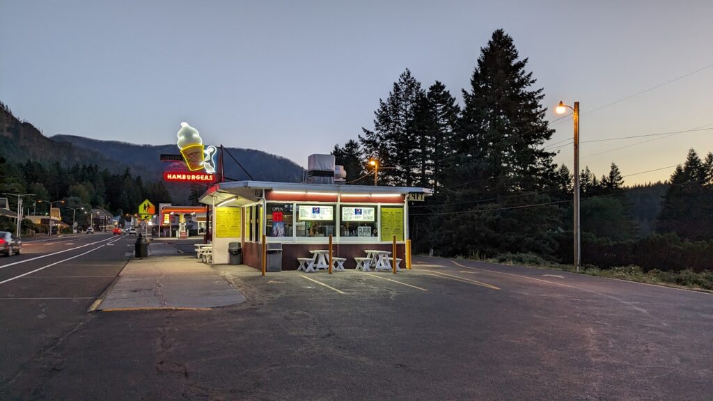 Eastwind Drive-In all lit up at sunset.