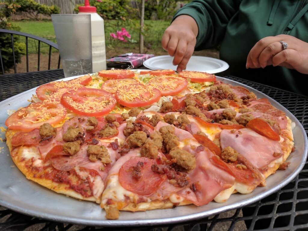 A delicious looking pizza with lots of toppings.