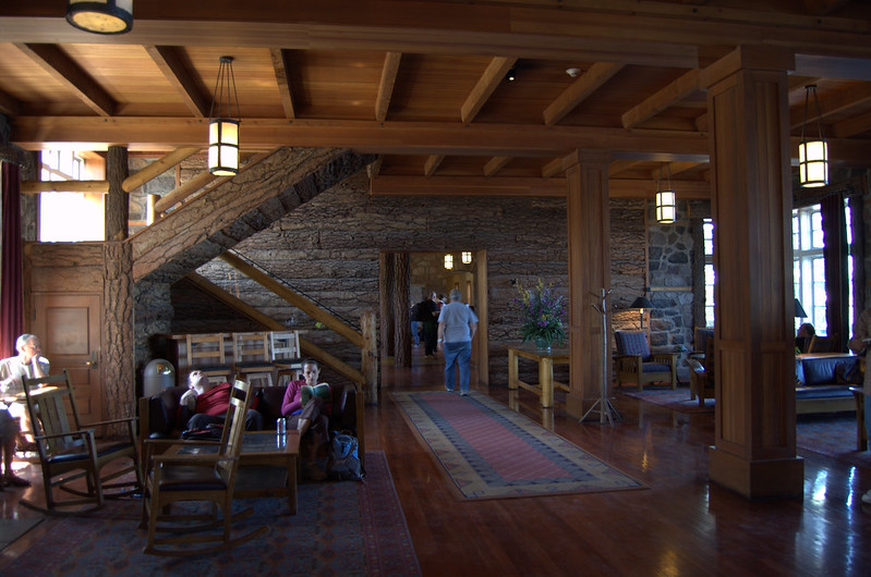 The interior of Crater Lake Lodge. It's has lots of warm colored wood.