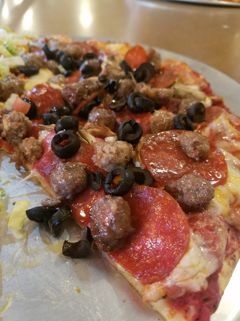 A tasty looking pizza with olives, sausage and pepperoni from Big John's Pizza in Pendleton, Oregon.