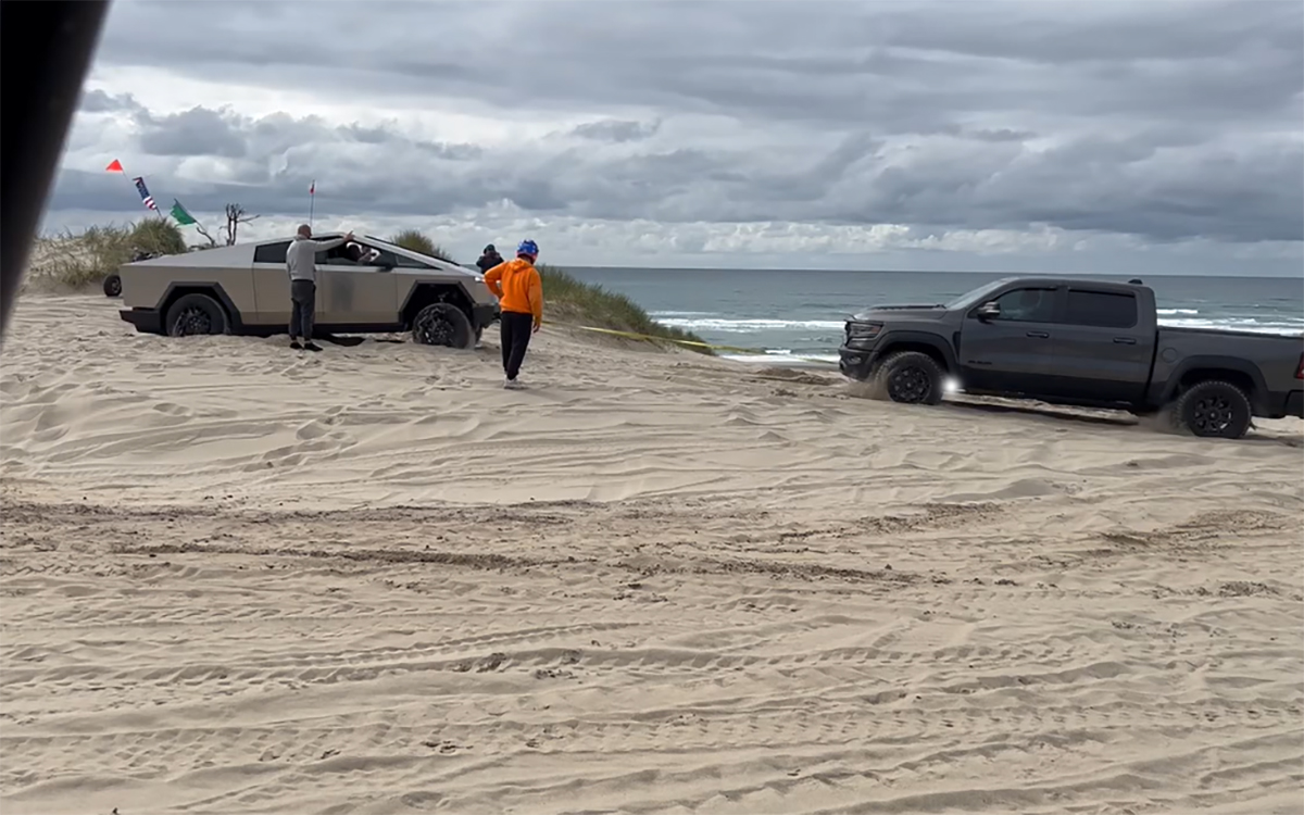 A Tesla Cybertruck stuck in the dunes.
