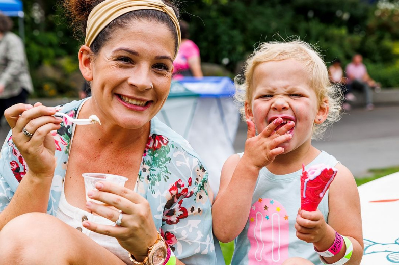 A mother and her child enjoy delicious ice cream.