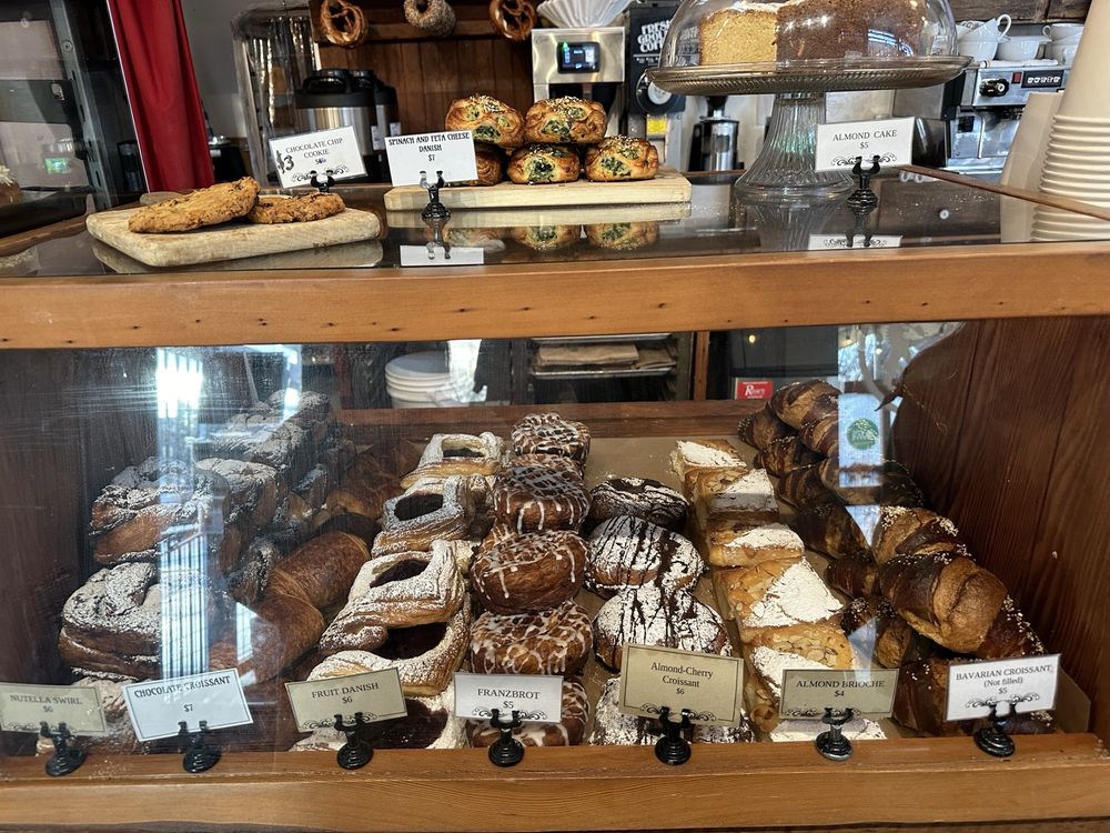 A display case of authentic German pastries at Fressen Artisan Bakery.