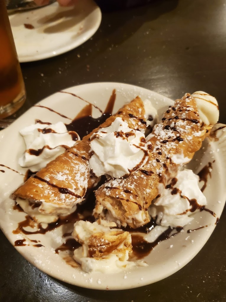 Delicious looking dessert drizzled with chocolate sauce.