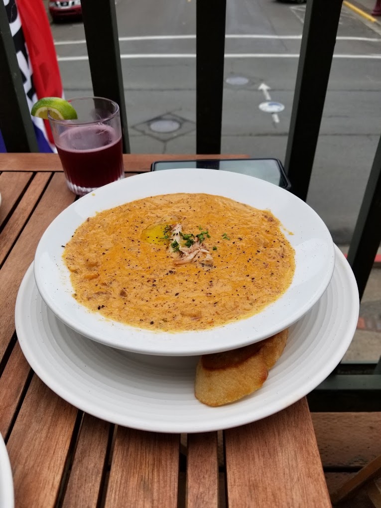 A large yummy looking bowl of soup.