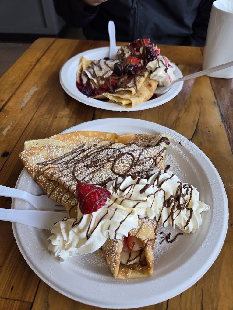 Crepes covered in delicious looking sweet toppings.