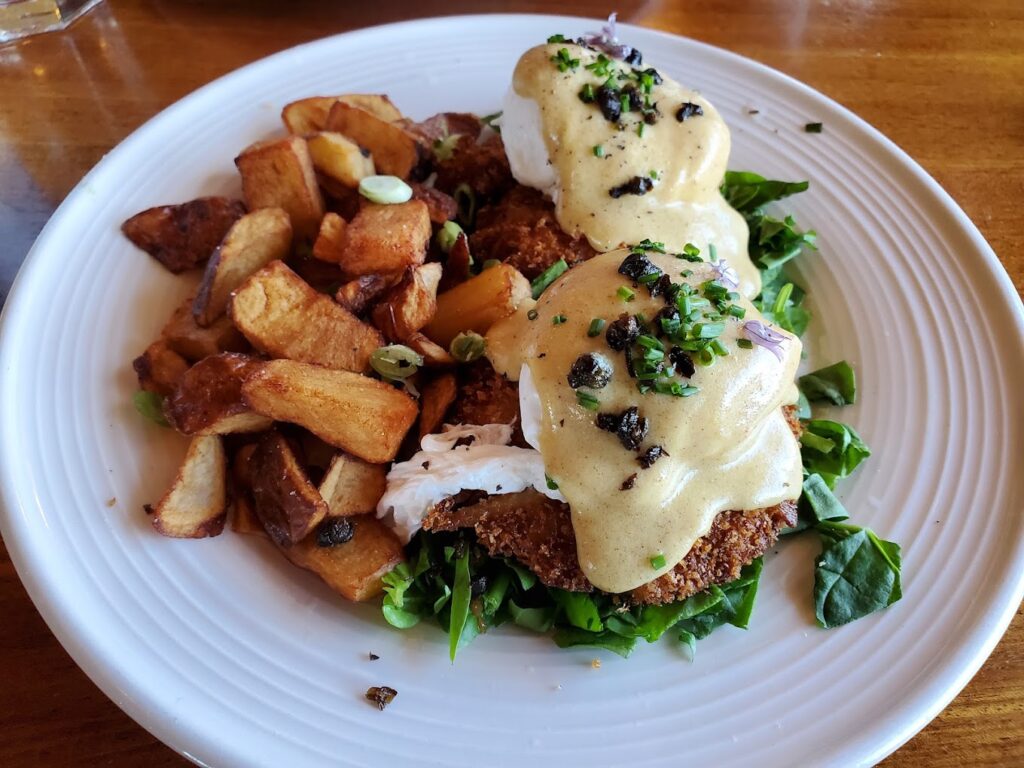 Eggs benedict with seafood.