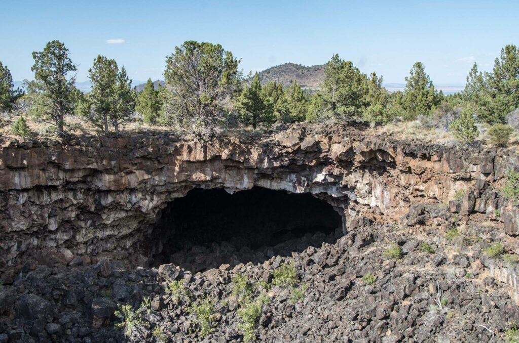 Looking down into a cave at the Lava Beds National Monument.