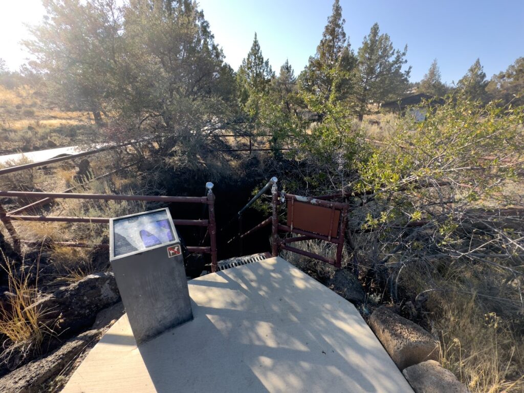 Looking down into a cave at the Lava Beds National Monument.