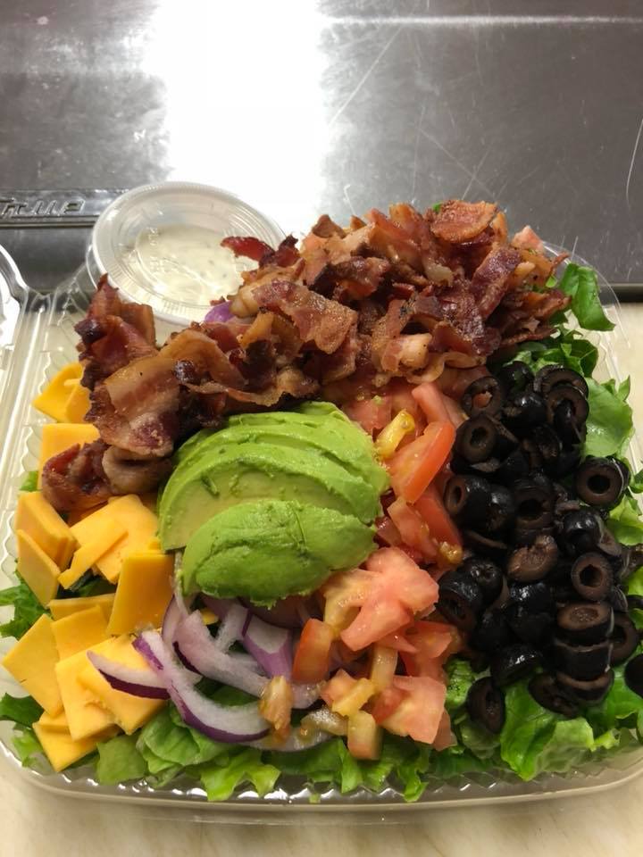 A delicious looking salad filled with toppings.