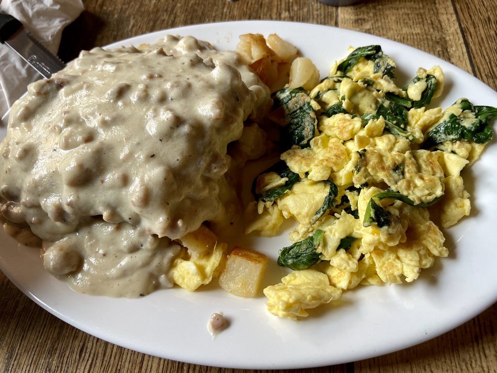 Chicken fried steak and eggs. The chicken fried steak is covered in gravy.