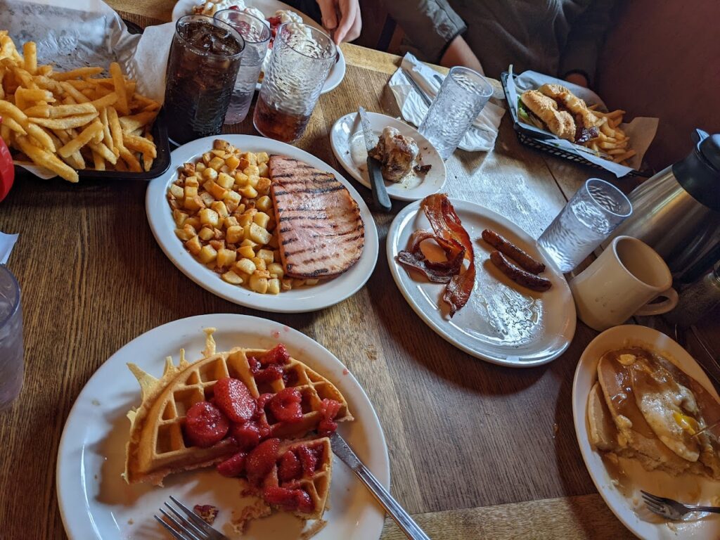 A table covered in delicious looking breakfast foods!