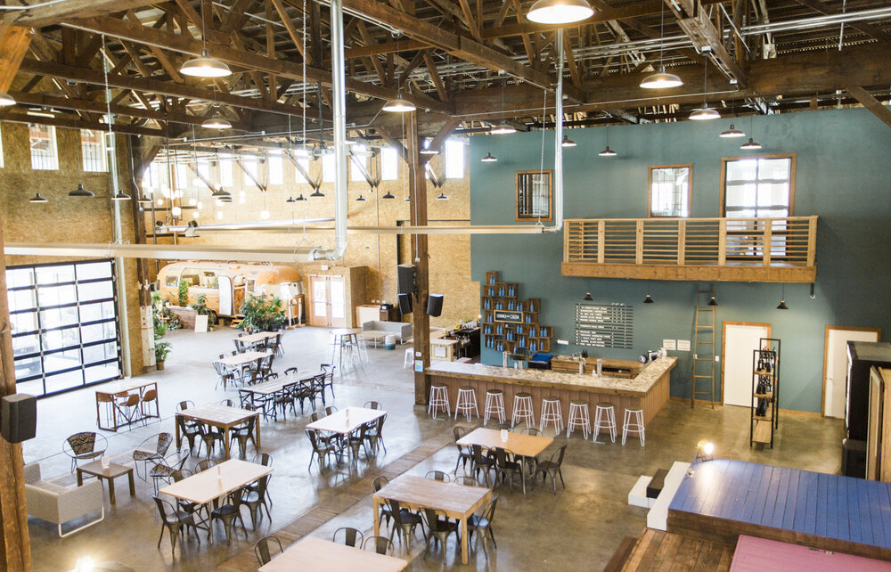 The interior of Mac Market has cool, hip vibes. It looks like a relaxing place to have a cup of coffee or a share a good meal with a friend. There are high ceilings and lots of natural light, along with wooden tables and chairs. It has a very modern, but down to earth feel about it.