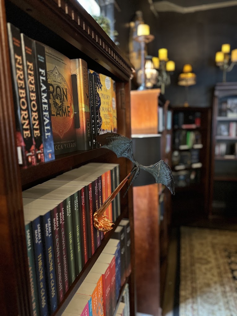 The interior of Daffodil Romantasy Books features a gorgeous dark academia aesthetic, cozy vibes, and lots of places to sit and enjoy coffee and a good book.