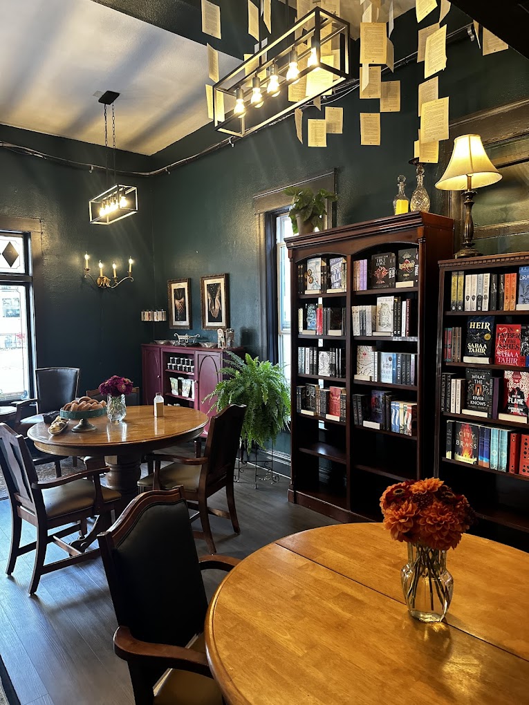 The interior of Daffodil Romantasy Books features a gorgeous dark academia aesthetic, cozy vibes, and lots of places to sit and enjoy coffee and a good book.