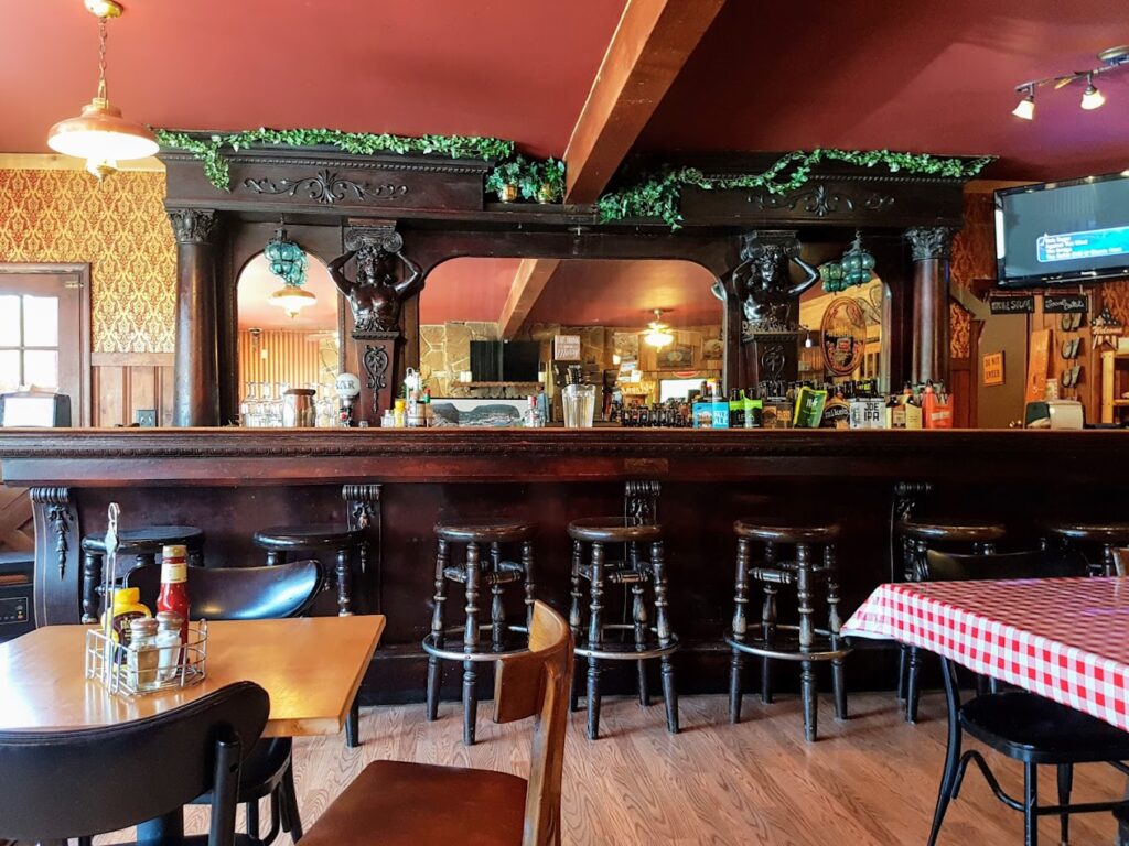 The historic wooden bar at Austin House in Bates, Oregon.