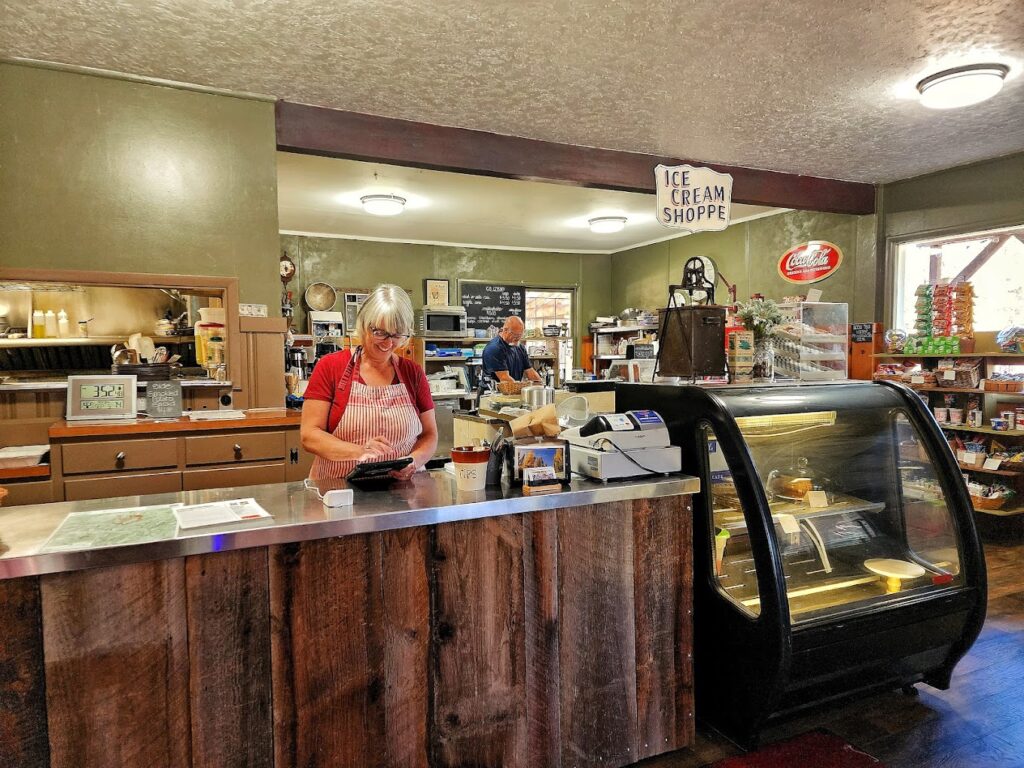 A woman works the counter at Austin House.